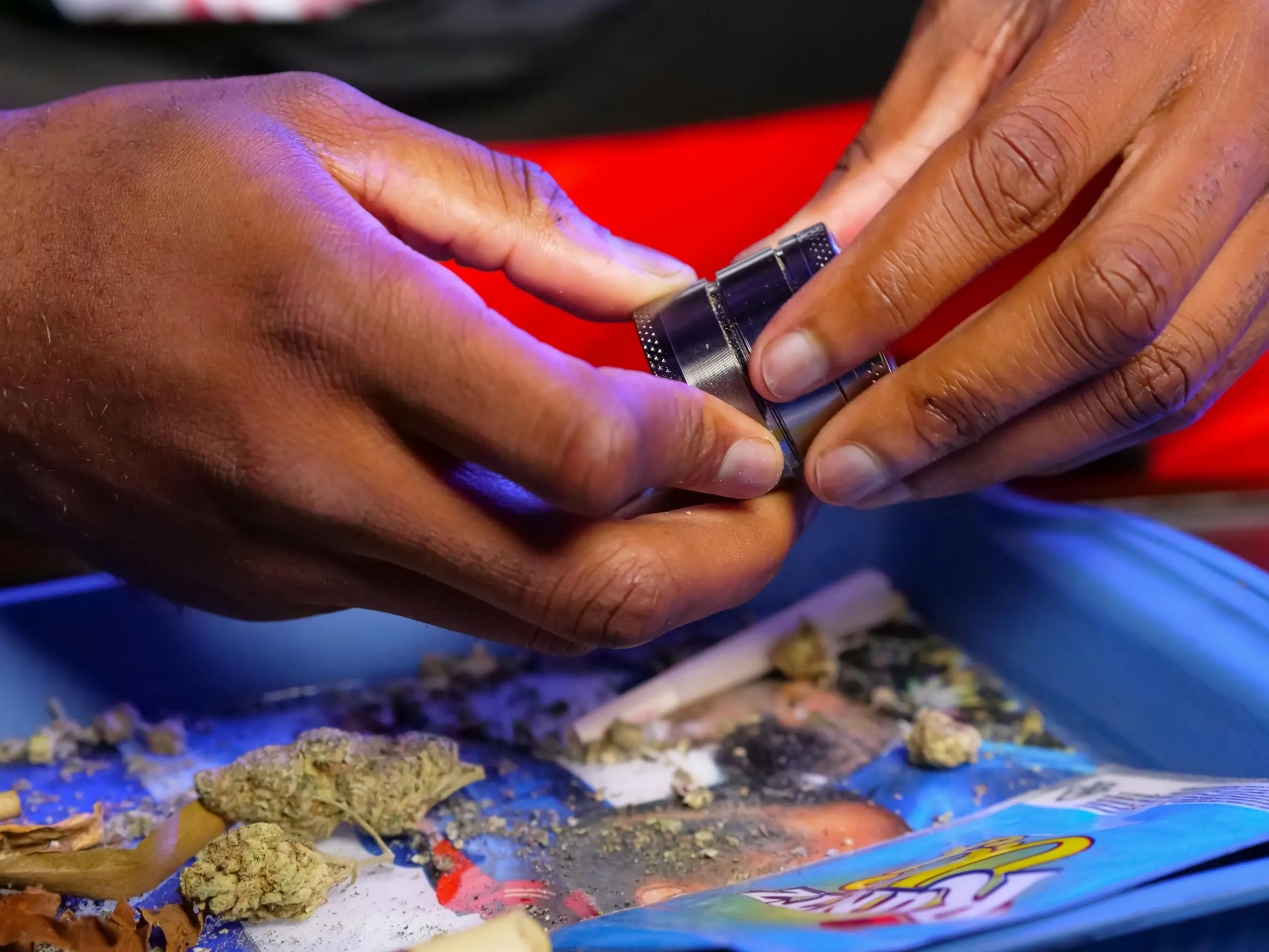 grinding cannabis flower